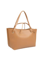 Tan handbag with gold hardware on a light gray background